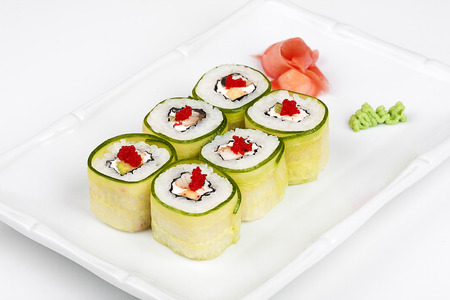 Sushi roll with avocado, cucumber and caviar.の写真素材