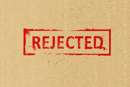 Rejected stamping on brown paperの写真素材