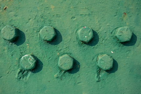 Metal beams with screws with paint colorの写真素材
