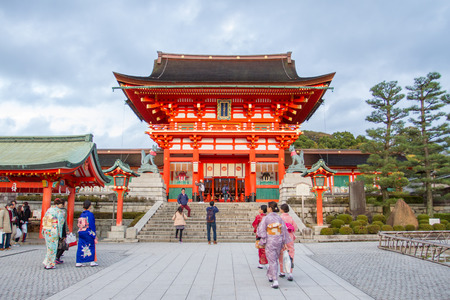 KYOTO - DEC 15 : Traveler walking in the Fushimi Inari Taisha Shrine on 14 Dec 2015. The shrine sits which is 233 meter above sea level, and includes trails up the mountain to many smaller shrines.のeditorial素材