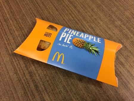 BANGKOK THAILAND 15 JULY 2017: A McDonald's Pineapple Pie on the table. McDonald's is the world's largest fast foodのeditorial素材