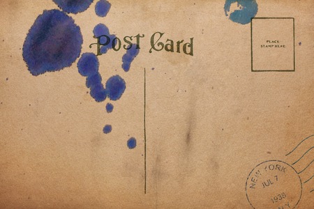 Back of vintage blank postcard with dirty stainの写真素材