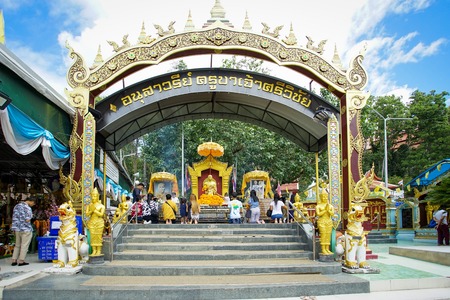 Chiangmai Thailand - 29 June 2019: Many people come to pray at the golden monk statue namedのeditorial素材
