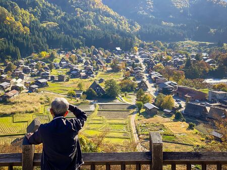 Shirakawa Japan - 12 Nov 2019: peopl look at View from the hill see the Shirakawago village in the autumn .It is a village with beautiful scenery reminiscent of the old days.のeditorial素材