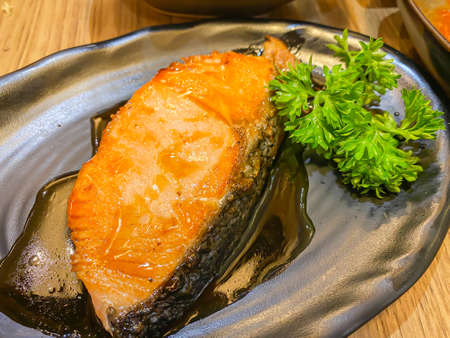 Salmon grilled with teriyaki sauce on the tableの写真素材