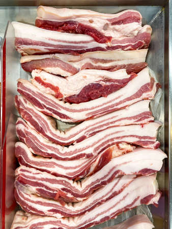 Streaky pork in tray for sale in supermarketの写真素材