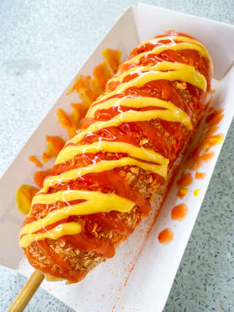 Korean style Corn Dog Hatog topping  mustard and ketchupの写真素材