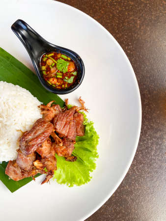 Fried Pork with Garlic Pepper on Riceの写真素材