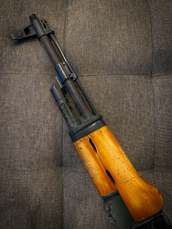AK-47 assault rifle on the sofa