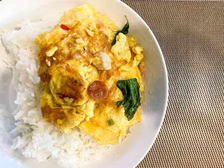 Rice with omelet on the table ready to eatの写真素材