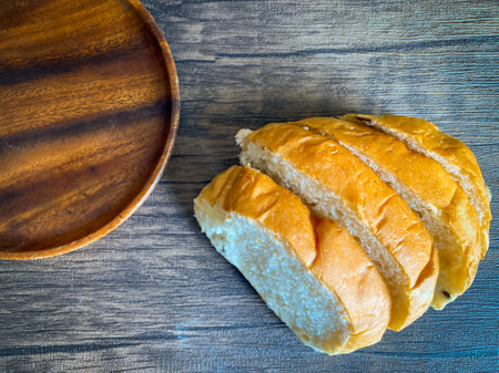 Whole grain bread ready to eat on the wooden backgroundの写真素材