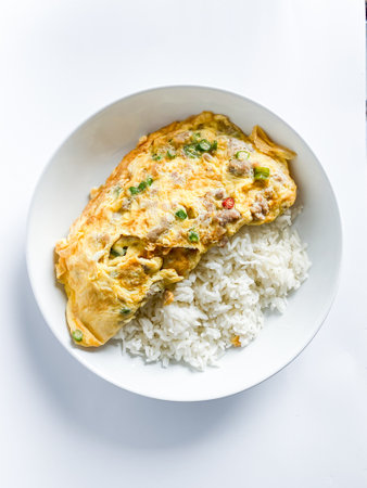 Omelet with pork and chili on rice on  the white backgroundの写真素材