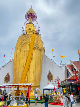 Bangkok Thailand - 1 Aug 2023: Many people pray the giant Buddha statue at the Indharaviharn temple on Asarnha Bucha dayのeditorial素材