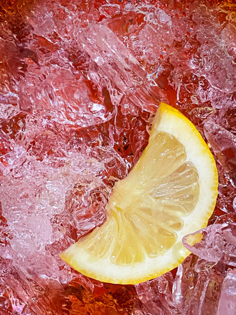 Sliced fresh lemon and ice cubes on the backgroundの写真素材