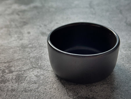 Blank ceramic bowl on the floorの写真素材