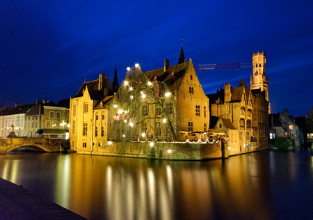 Rozenhoedkai in bruges  Belgium decorated in christmas lights in December 2017. The blue color in sky adding to christmas vibeのeditorial素材