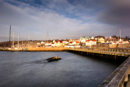Saltholmen houses immersed in golden light during evening sunset at gothenburg Swedenのeditorial素材