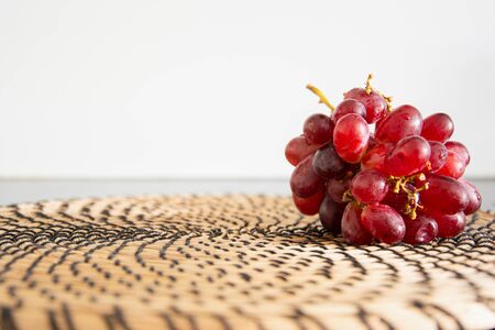 Red grapes separated and photographed against white background with space for content,Swedenの写真素材