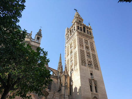 Horizontal view of the Giralda of the Cathedral of Seville, Photograph taken on clear day without clouds, against light and blue sky - Photograph taken on October 31, 2017, Seville, Andalucia, Spain, Europeのeditorial素材