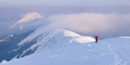 Winter - happy climber in high mountainsの写真素材