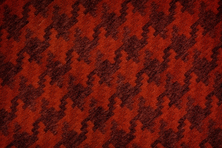 Close up of dark red colored wool textile in Hi-Res