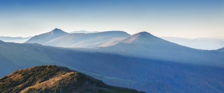 Panorama of the autumn mountains in the mistの写真素材