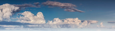 Panorama of the white fluffy clouds in the fantastic blue sky.の写真素材