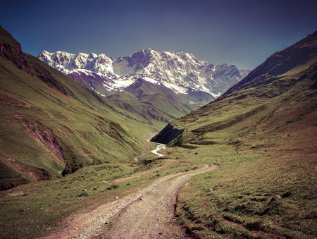 The main Caucasian ridge. The view from the Ushguli village. Georgia, Svaneti. Retro style.の写真素材