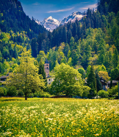 Beautiful spring landscape with church in Bondo village in the Swiss Alps. Bregaglia, Switzerland, Europe.の写真素材
