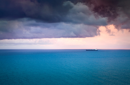 Industrial ship in the Tyrrhenian sea near the coast of Sicily before the storm.の写真素材
