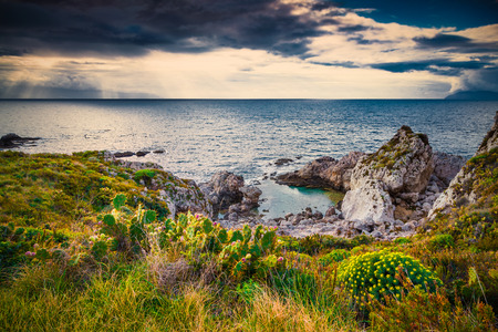 Dramatic spring sunset on the the cape Milazzo, nature reserve Piscina di Venere, Sicily, Italy, Tyrrhenian sea, Europe.の写真素材