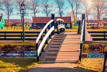Authentic Holland architecture on the water channel in Zaanstad village. Famous Netherlands canals, Europeの写真素材