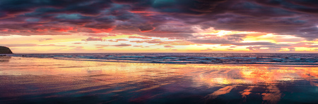 Colorful panorama of sunset on the beach near Grundarfjordur town. Night scene on the Snaefellsnes...