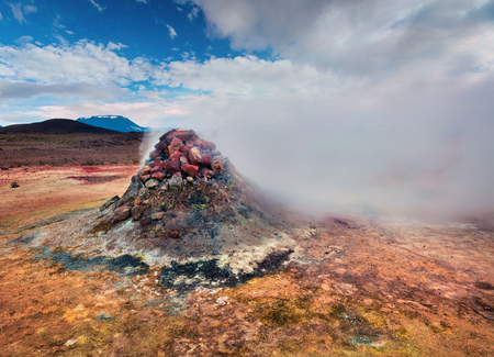 Steaming fumarole in geothermal valley Hverarond, located near Reykjahlid village in north of Iceland, Europe. Artistic style post processed photo.  の写真素材
