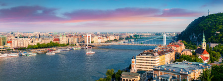Panoramic cityscape of Pest city with Elisabeth Bridge on the Danube river. Colorful spring sunset in Budapest, Hungary, Europe. Artistic style post processed photo.の写真素材