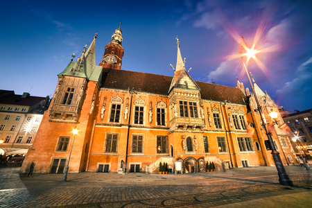 Colorful evening scene on Wroclaw Market Square with Town Hall. Sunset in historical capital of Silesia, Poland, Europe. Artistic style post processed photo.の写真素材