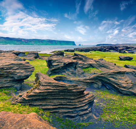Typical Icelandic landscape on the south coast of Iceland. Colorful summer morning with volcanic ground. Artistic style post processed photo.の写真素材
