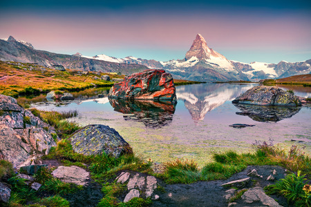 Colorful summer view of the Stellisee lake. Few minutes before sunrise. Great outdoor scene with Matterhorn (Monte Cervino, Mont Cervin) in Swiss Alps, Switzerland, Europe.の写真素材