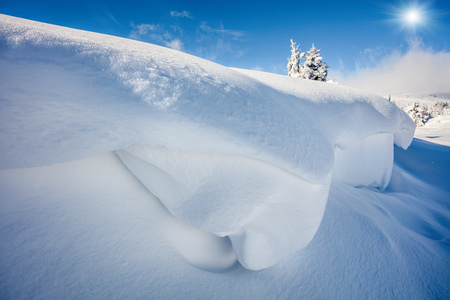 Huge mounds of snow in Carpathian mountains. Sunny outdoor scene, Happy New Year celebration concept. Artistic style post processed photo.の写真素材