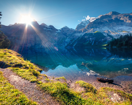 Colorful summer morning on the unique Oeschinensee Lake. Splendid outdoor scene in the Swiss Alps...