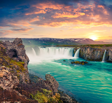Picturesque summer morning scene on the Godafoss Waterfall. Colorful sunrise on the on Skjalfandafljot river, Iceland, Europe. Artistic style post processed photo.の写真素材