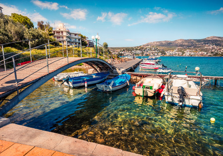 Colorful spring scene of the Porto Rafti port. Sunny morning seascape of Aegean sea, Greece.の写真素材