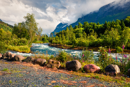 Dramatic summer view of Loelva river, located near Loen village, municipality of Stryn, Sogn og Fjordane county, Norway. Colorful sunny scene in Norway. Beauty of nature concept background.の写真素材