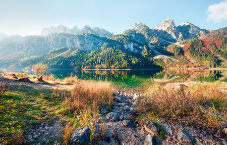 Bright autumn scene of Vorderer ( Gosausee ) lake. Picturesque morning view of Austrian Alps, Upper Austria, Europe. Beauty of nature concept background.の写真素材