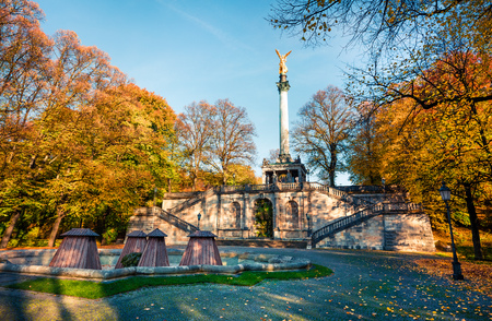 Picturesque autumn view of Angel of Peace (Friedensengel) monument, park statue of a golden angel on a column is a monument to peace with mosaics and a viewing deck, Munich, Bavaria, Germany, Europe.の写真素材