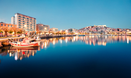 Marvelous spring seascape on Aegean Sea. Coloful evening scene of Kavala city, the principal seaport of eastern Macedonia and the capital of Kavala regional unit. Greece, Europe.の写真素材