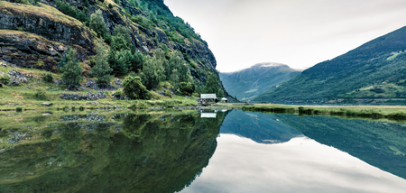Beautiful summer view of Sognefjorden fjord. Green morning scene of Flom port, Norway. Beauty of nature concept background.の写真素材