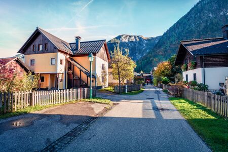 Sunny autumn cityscape of Hallstatt. Splendid evening view of countryside, alzkammergut region,...