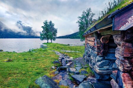 Foggy summer view of the Innerdalsvatna lake. Colorful morning scene in Norway, Europe. Beauty of...