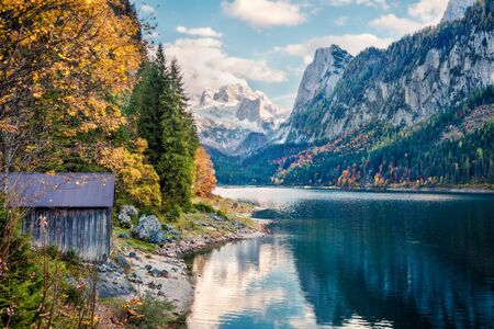 Colorful autumn scene of Vorderer ( Gosausee ) lake with Dachstein glacier on background. Amazing morning view of Austrian Alps, Upper Austria, Europe. Orton Effect.の写真素材